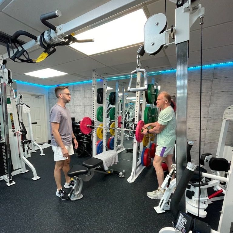 Damian Churchill coaching a client one-on-one